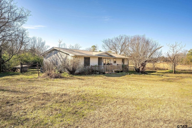 ranch-style house with a front lawn