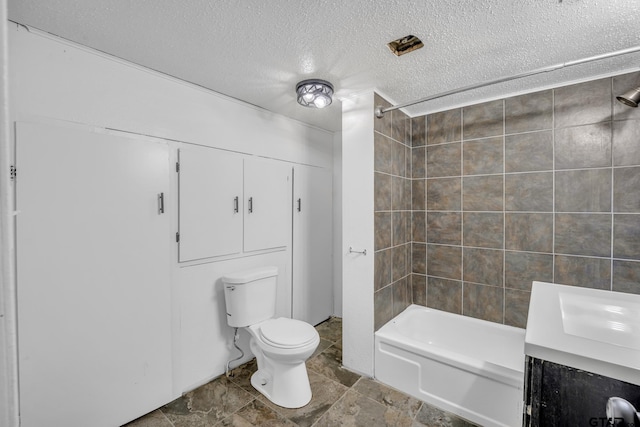 1005 N Rodeo St, Gladewater, TX 75647 - bathroom featuring a textured ceiling, toilet, tub / shower combination, and a sink