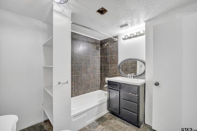 1005 N Rodeo St, Gladewater, TX 75647 - full bathroom featuring a textured ceiling, shower / bath combination, vanity, and stone finish floors