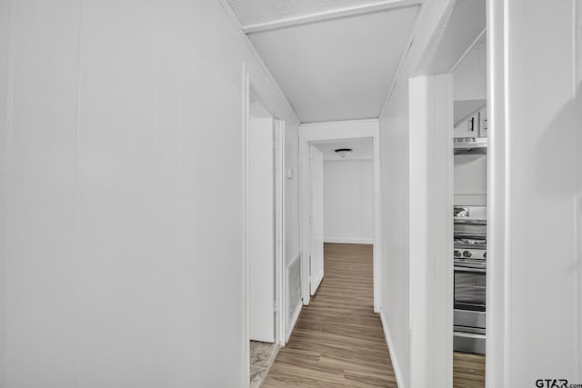 1005 N Rodeo St, Gladewater, TX 75647 - corridor featuring light wood-style flooring and baseboards