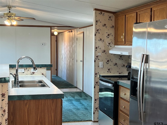 kitchen featuring light carpet, stainless steel appliances, vaulted ceiling, ceiling fan, and sink