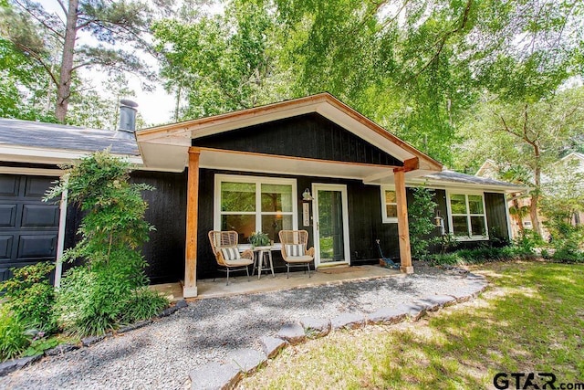 1510 Hideaway Ln W, Hideaway, TX 75771 - back of property with a porch