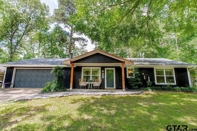 1510 Hideaway Ln W, Hideaway, TX 75771 - ranch-style home featuring an attached garage, a front lawn, and driveway