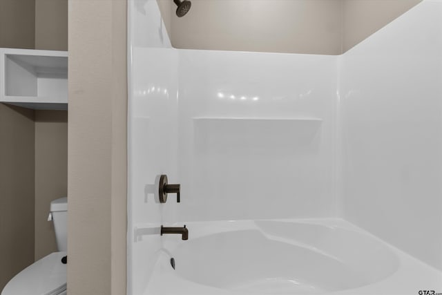 bathroom with shower / bath combination and toilet