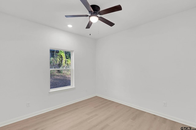 spare room with ceiling fan and light hardwood / wood-style flooring