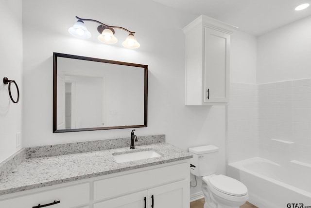 full bathroom featuring vanity,  shower combination, and toilet