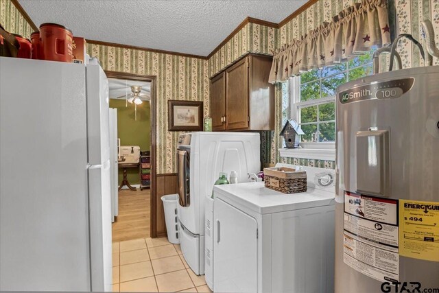 5626 Meadowdale Rd, Flint, TX 75762 - laundry room featuring water heater, wallpapered walls, ornamental molding, washer and clothes dryer, and a textured ceiling