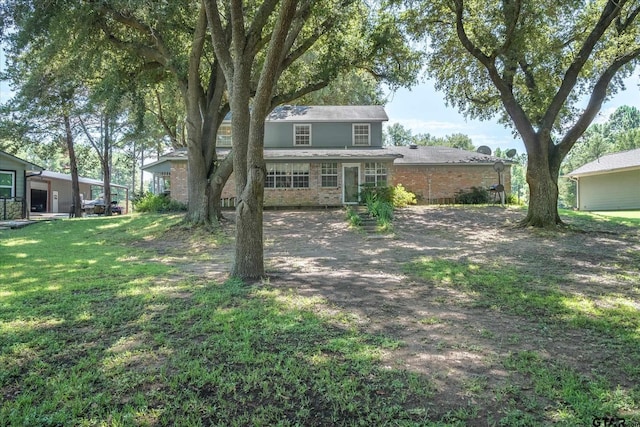 2222 County Road 1570, Alba, TX 75410 - view of front facade with brick siding and a front lawn