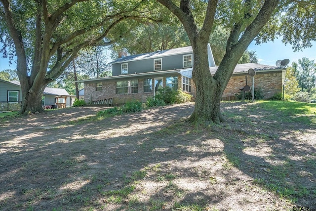 2222 County Road 1570, Alba, TX 75410 - view of front facade with brick siding and a chimney