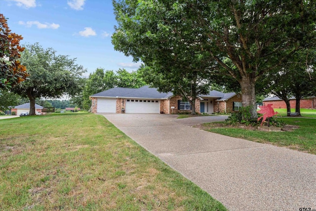 single story home featuring a front lawn and a garage