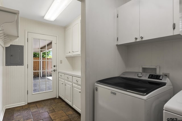 909 Elizabeth St, Gilmer, TX 75644 - laundry area with electric panel, cabinet space, dark stone finish floors, and separate washer and dryer