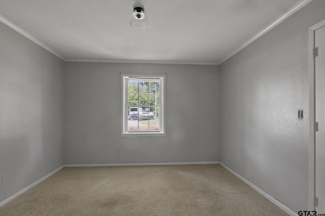 909 Elizabeth St, Gilmer, TX 75644 - unfurnished room featuring ornamental molding, light carpet, and baseboards