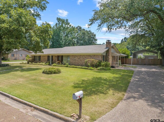 single story home with a front yard