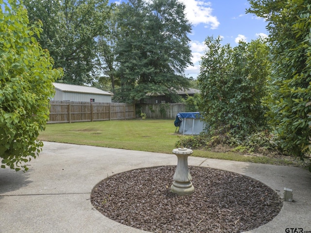 909 Elizabeth St, Gilmer, TX 75644 - view of yard featuring a patio