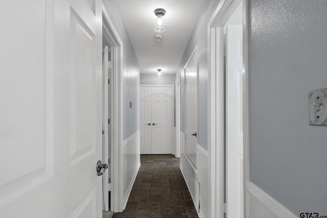 909 Elizabeth St, Gilmer, TX 75644 - hallway featuring stone tile flooring