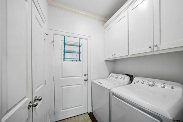 laundry room with cabinets, ornamental molding, and separate washer and dryer