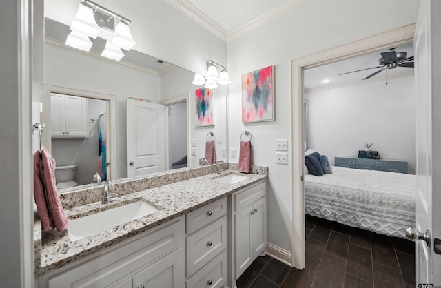 bathroom featuring vanity, ornamental molding, toilet, and ceiling fan