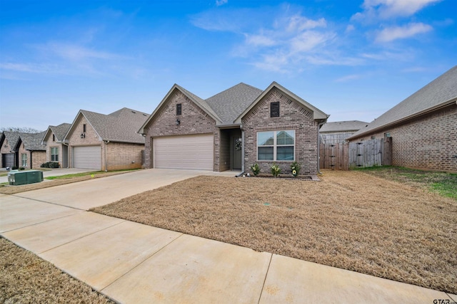 view of front facade with a garage and a front lawn