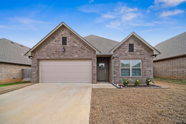 view of front of house with a garage and a front lawn