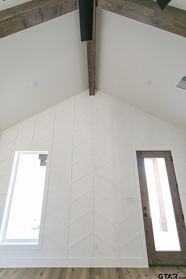 details with beam ceiling and hardwood / wood-style floors