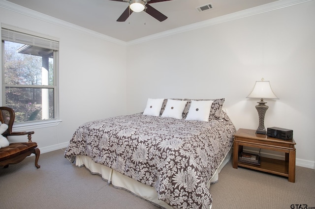 bedroom with baseboards, ornamental molding, visible vents, and light colored carpet