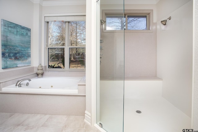 bathroom with a whirlpool tub, ornamental molding, and tile patterned flooring