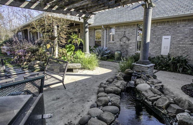 view of patio / terrace featuring a pergola