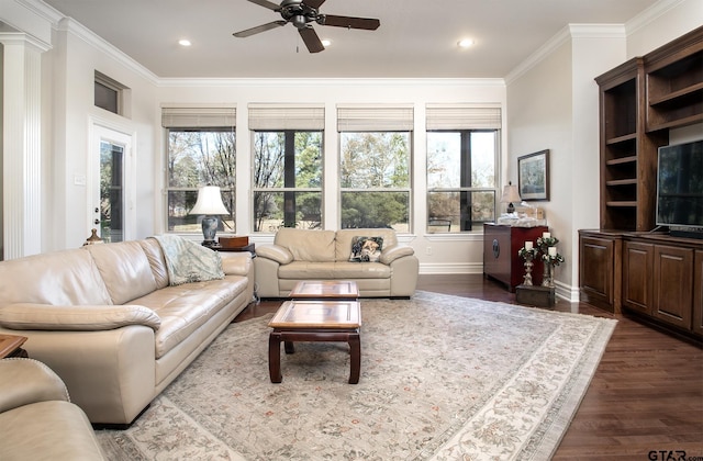 living area with recessed lighting, dark wood-style flooring, crown molding, and decorative columns