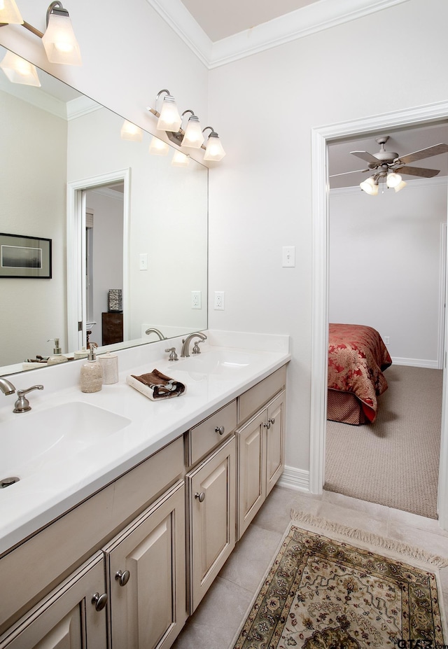 ensuite bathroom featuring a sink, ensuite bath, double vanity, and crown molding