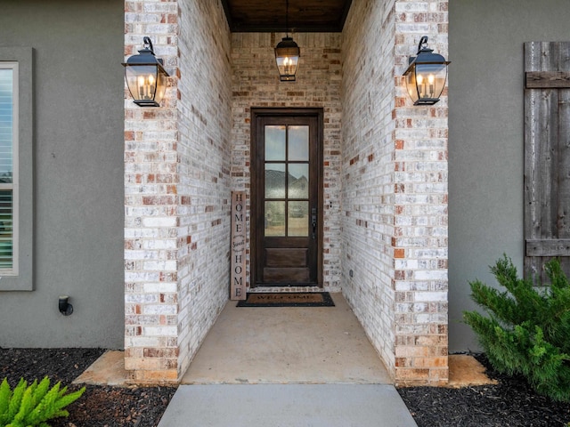 property entrance with brick siding