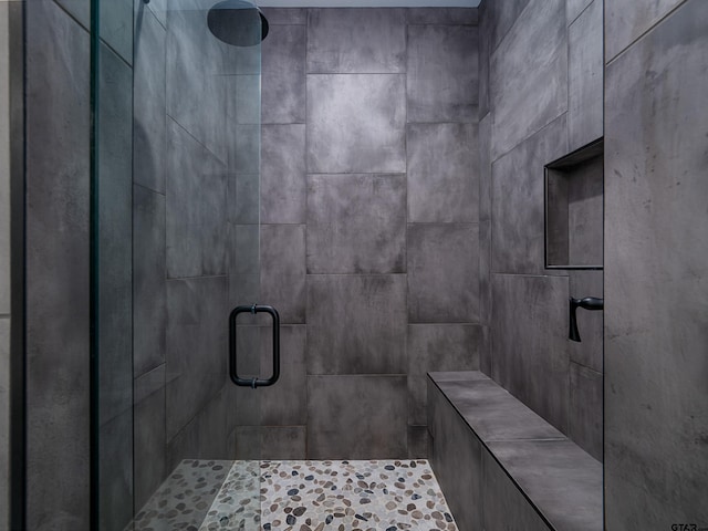 bathroom with a shower stall