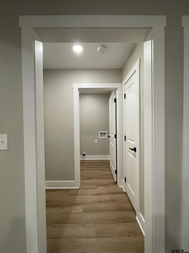 corridor with light wood-type flooring