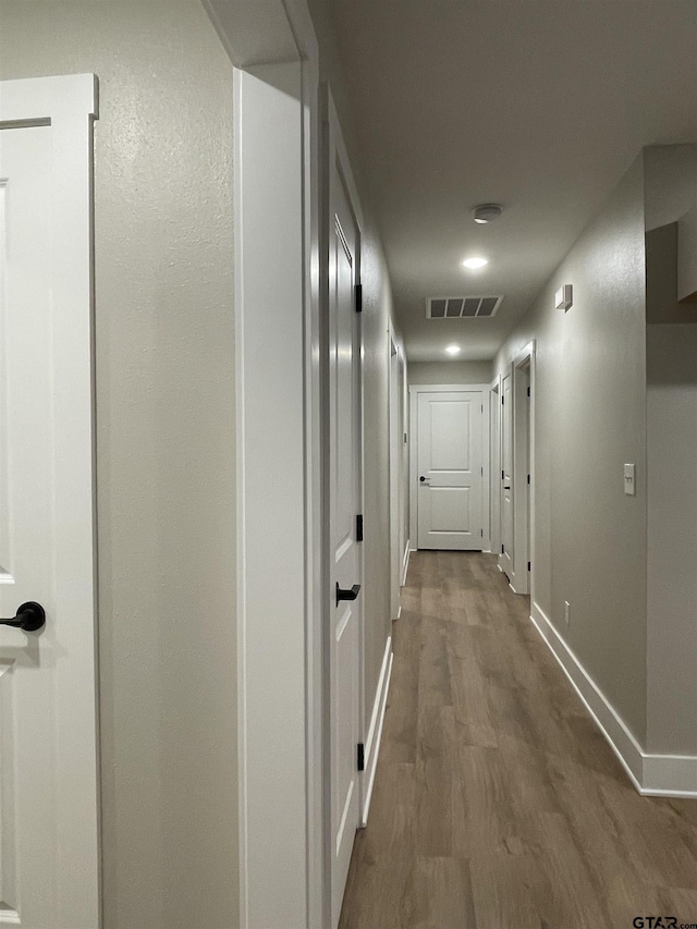 hallway featuring hardwood / wood-style floors