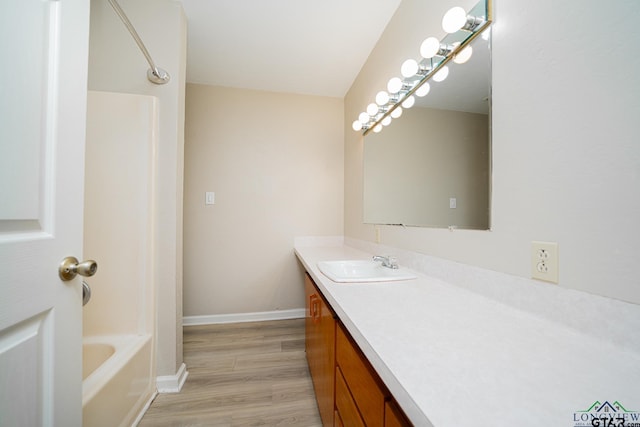 bathroom featuring vanity and wood-type flooring