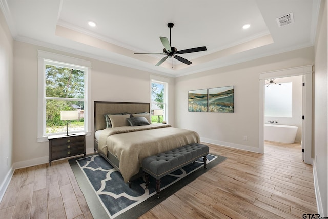 14738 Woodland Creek Dr, Tyler, TX 75706 - bedroom featuring a raised ceiling, multiple windows, light wood-style floors, crown molding, and recessed lighting