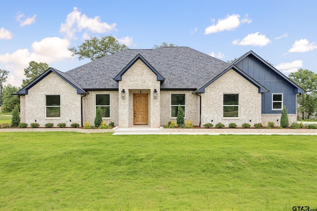 14738 Woodland Creek Dr, Tyler, TX 75706 - view of front of property with brick siding, a front lawn, board and batten siding, and a shingled roof