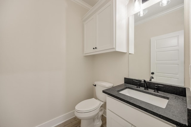 14738 Woodland Creek Dr, Tyler, TX 75706 - bathroom featuring ornamental molding, baseboards, wood finished floors, vanity, and toilet