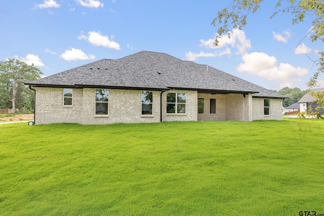 14738 Woodland Creek Dr, Tyler, TX 75706 - back of property with a lawn, brick siding, and roof with shingles