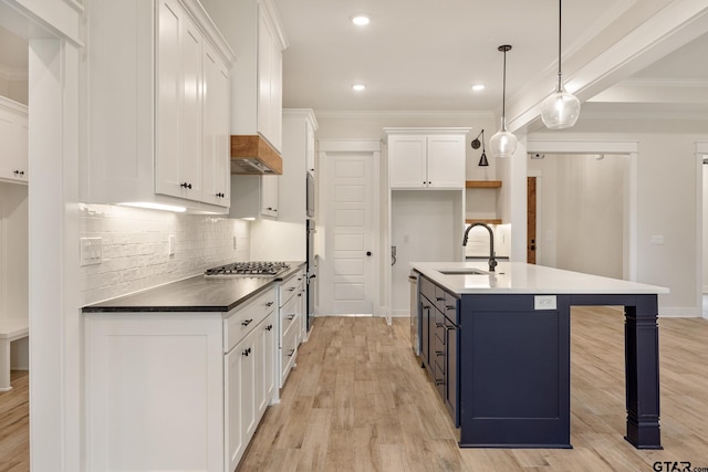 14738 Woodland Creek Dr, Tyler, TX 75706 - kitchen featuring a sink, stainless steel appliances, white cabinets, tasteful backsplash, and ornamental molding