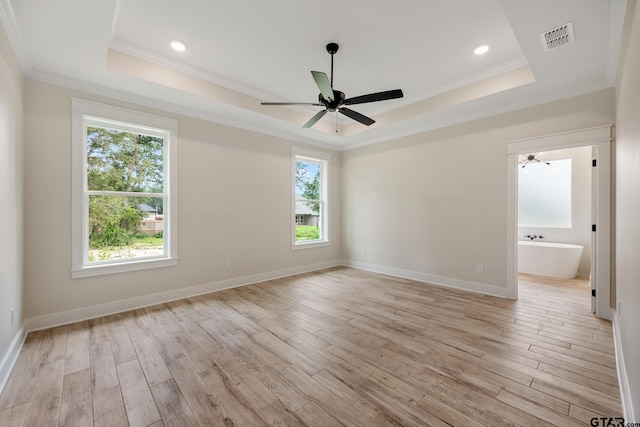 14738 Woodland Creek Dr, Tyler, TX 75706 - unfurnished room with a tray ceiling, ornamental molding, plenty of natural light, a ceiling fan, and recessed lighting