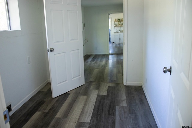 hallway with dark wood-type flooring