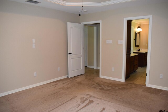 17387 Cherokee Trl, Flint, TX 75762 - unfurnished bedroom with light colored carpet, baseboards, connected bathroom, and crown molding