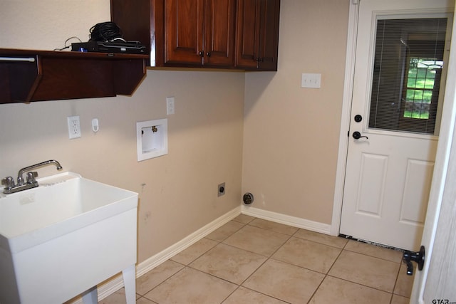 17387 Cherokee Trl, Flint, TX 75762 - washroom featuring cabinet space, baseboards, washer hookup, light tile patterned floors, and electric dryer hookup