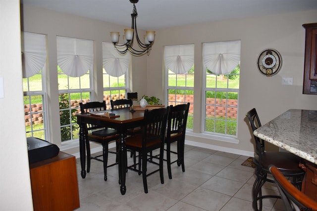 17387 Cherokee Trl, Flint, TX 75762 - dining room with a chandelier, plenty of natural light, light tile patterned floors, and baseboards