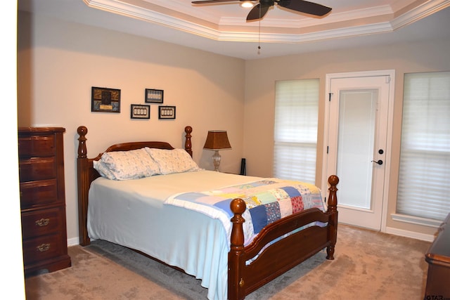 17387 Cherokee Trl, Flint, TX 75762 - carpeted bedroom featuring a tray ceiling, ornamental molding, and a ceiling fan