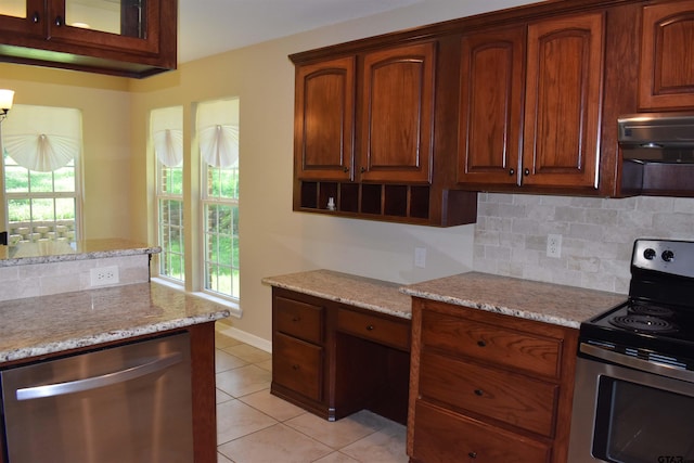 17387 Cherokee Trl, Flint, TX 75762 - kitchen featuring stainless steel appliances, decorative backsplash, light stone countertops, light tile patterned floors, and under cabinet range hood