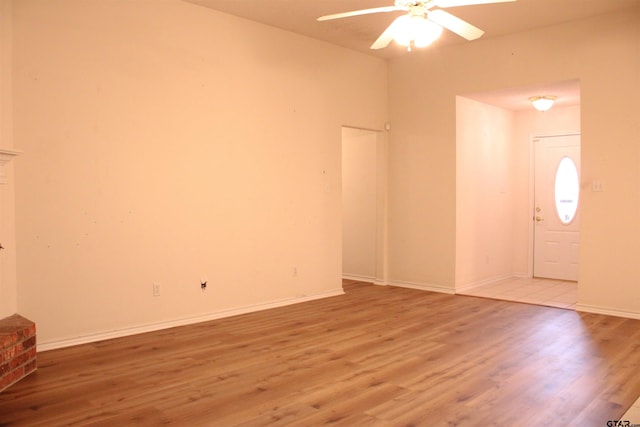 interior space with ceiling fan and light hardwood / wood-style flooring