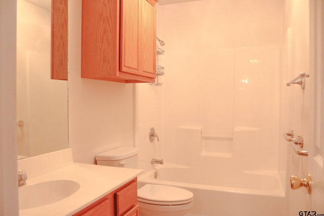 full bathroom featuring  shower combination, vanity, and toilet