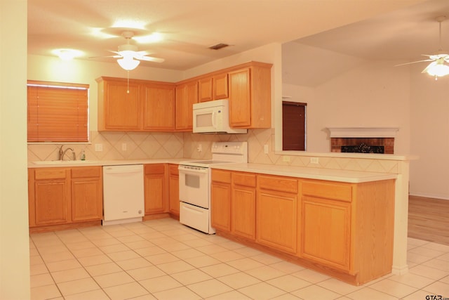 kitchen featuring light tile patterned floors, white appliances, sink, ceiling fan, and tasteful backsplash