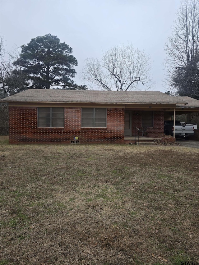 single story home with a carport and a front yard